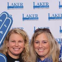 Two ladies posing together